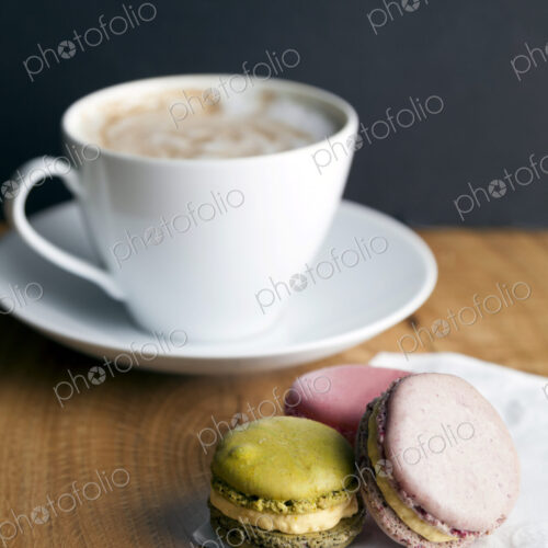 Close up of macaroon cookies and cup of coffee Close up of macaroon cookies and cup of coffee