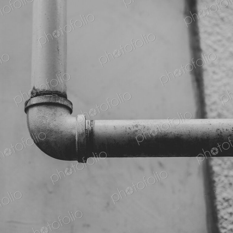 Close up of metal piping on building wall