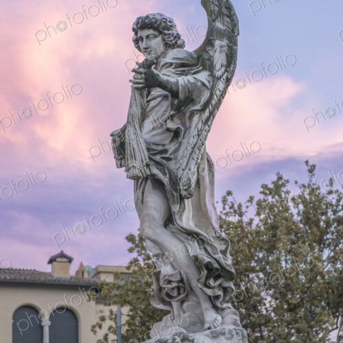 Close up of one of the Bernini angel statues on the Ponte Sant Angelo in Rome, Italy. Close up of one of the Bernini angel statues on the Ponte Sant Angelo in Rome, Italy.