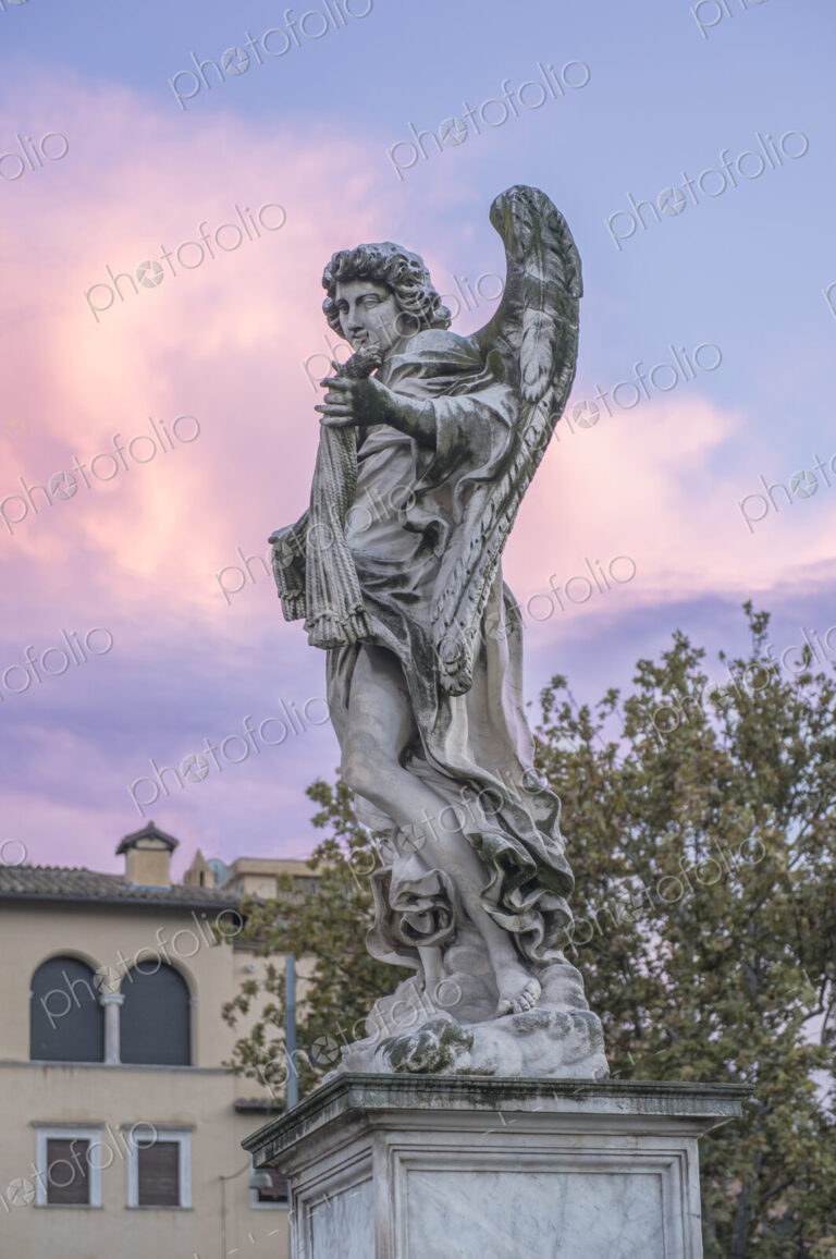 Close up of one of the Bernini angel statues on the Ponte Sant Angelo in Rome, Italy.