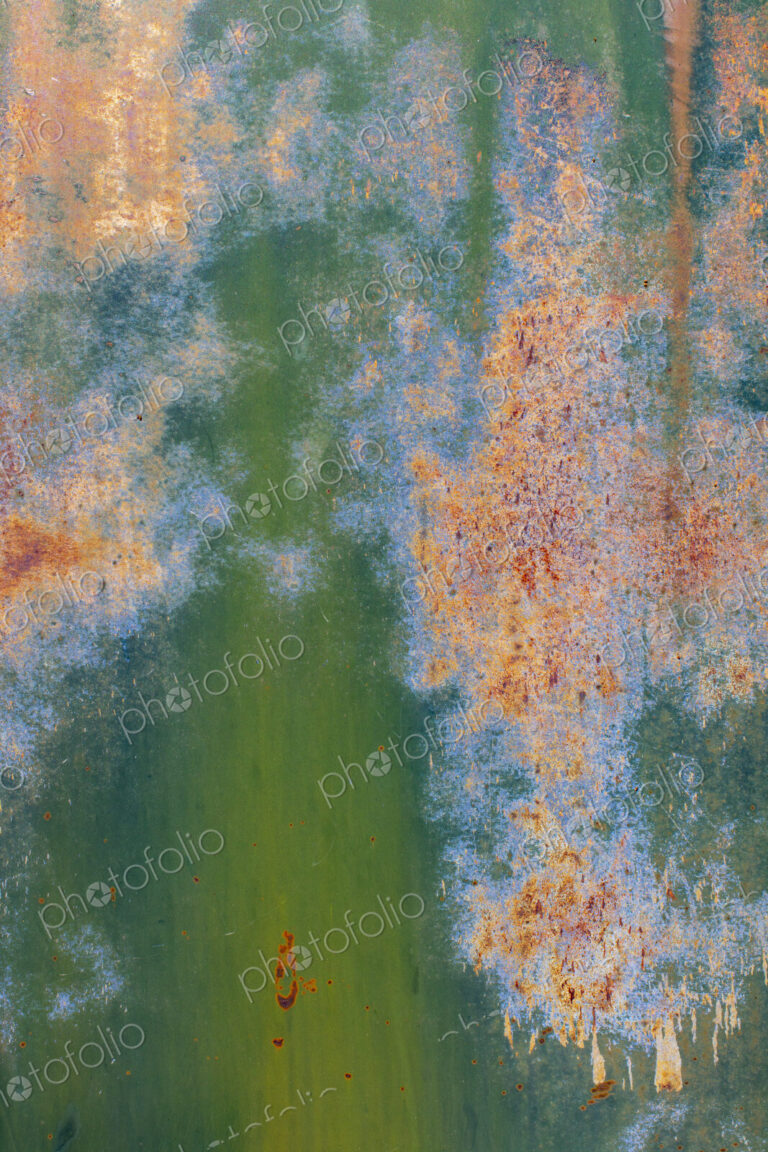 Close up of peeling green paint and rust