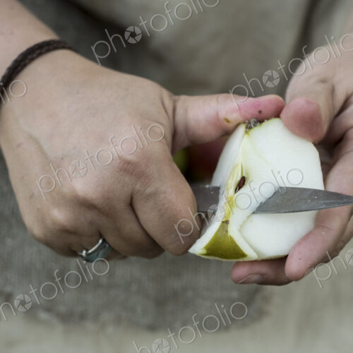 Close up of person peeling apple with knife. Close up of person peeling apple with knife.