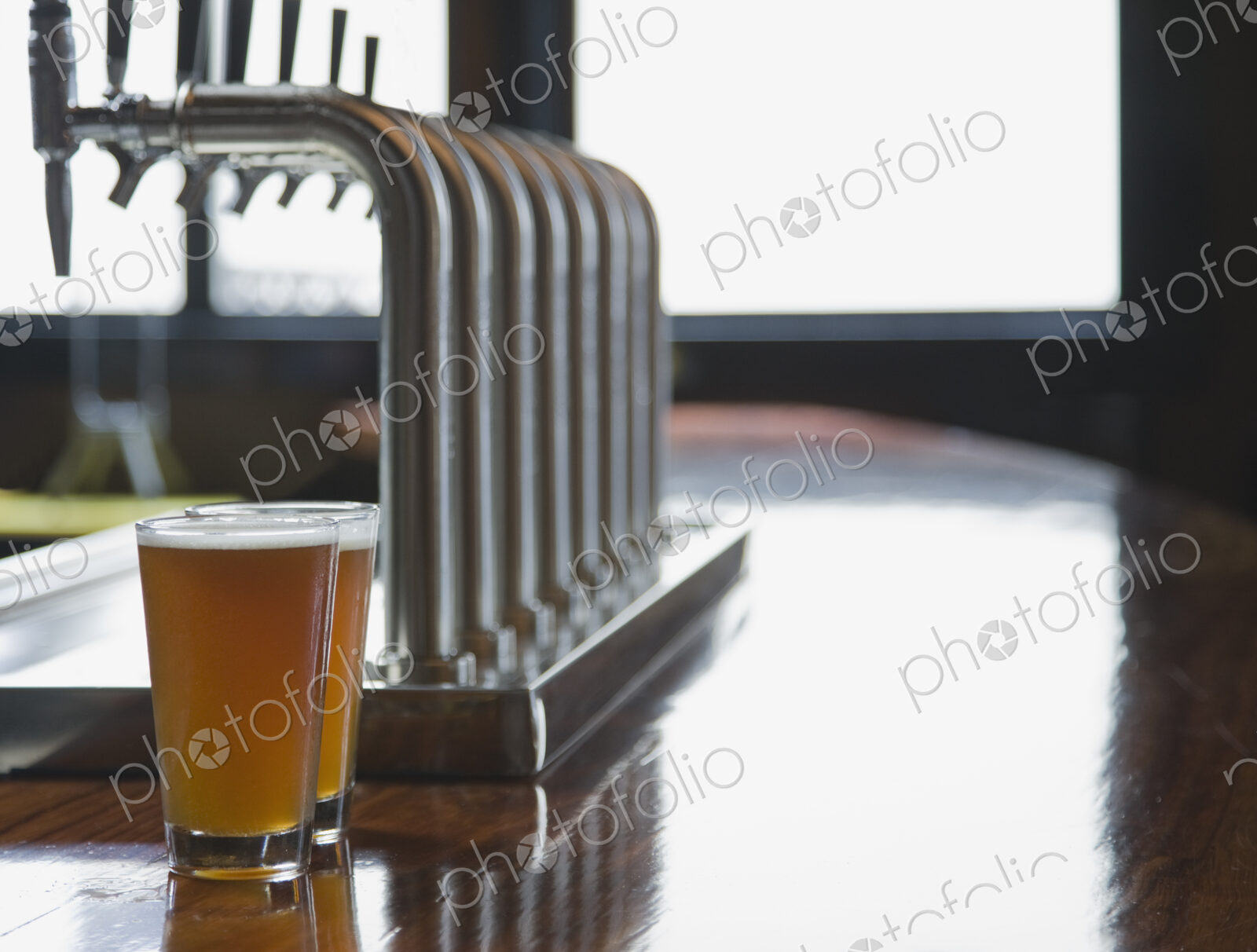 Close up of pints of beer on empty bar counter