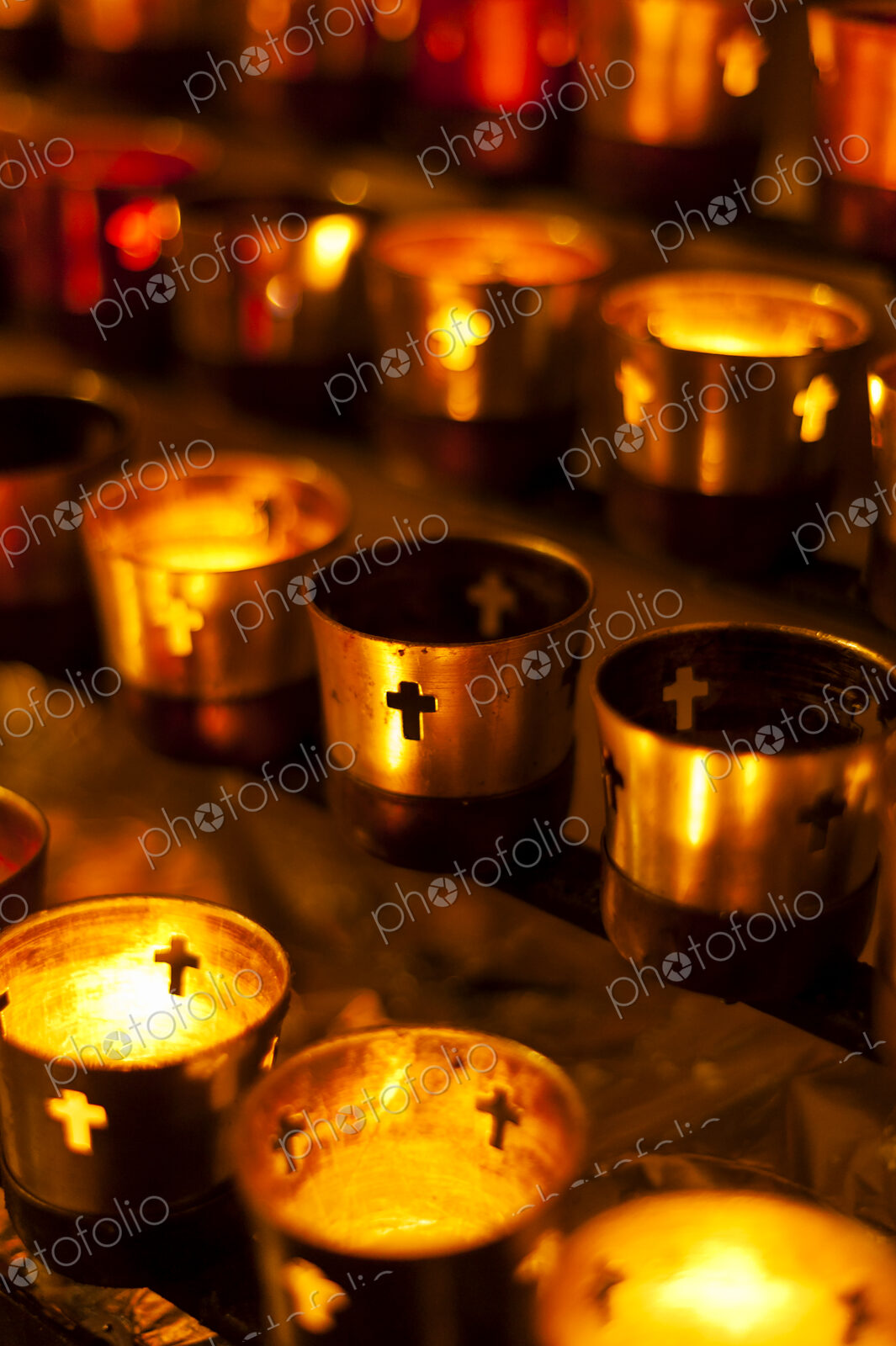 Close up of prayer candles glowing in church
