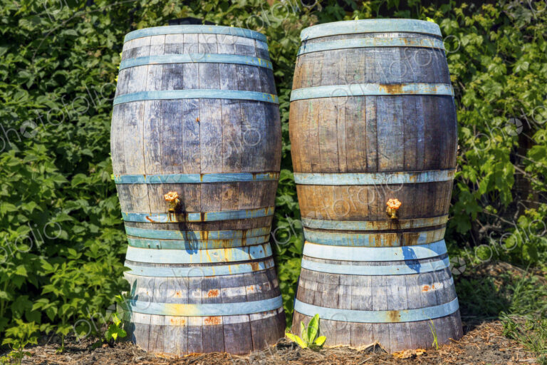 Close up of rain barrels with taps