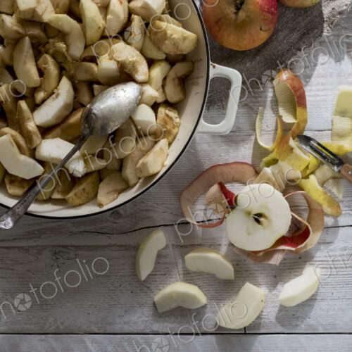 Close up of round baking tin with apple slices. Close up of round baking tin with apple slices.