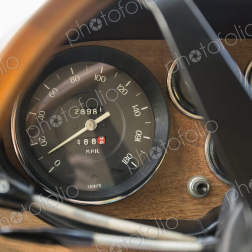 Close up of speedometer in retro Ferrari dashboard Close up of speedometer in retro Ferrari dashboard