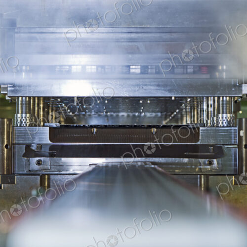 Close up of stamping and pressing machinery