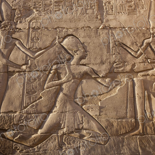 Close up of stone wall with ancient Egyptian bas-relief depicting Pharaoh. Close up of stone wall with ancient Egyptian bas-relief depicting Pharaoh.