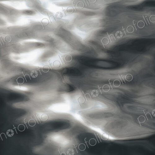 Close up of sunlight reflecting on moving water in Puget Sound, Washington, USA.