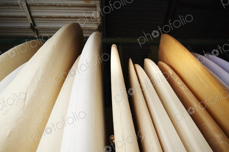 Close up of surfboards in store.