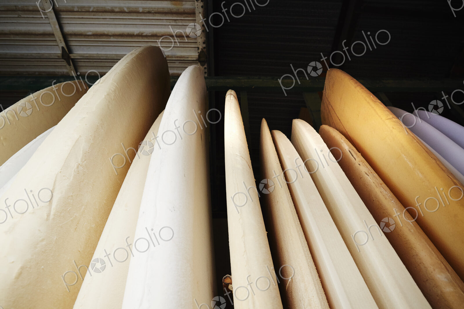 Close up of surfboards in store.
