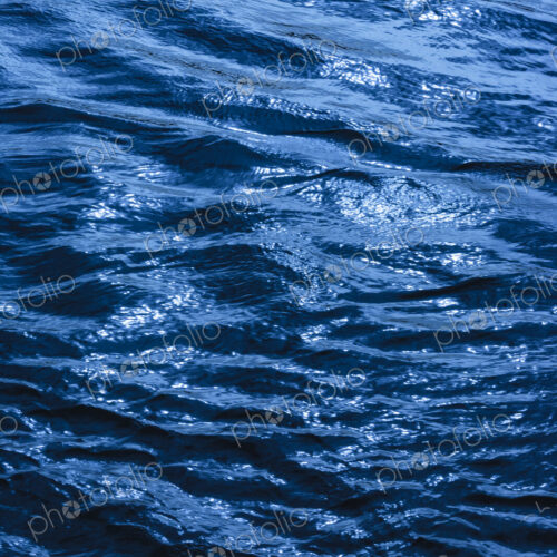 Close-up of the ripples of the water's surface. Close-up of the ripples of the water's surface.