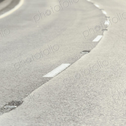 Close-up of the road surface on a curve in a road Close-up of the road surface on a curve in a road