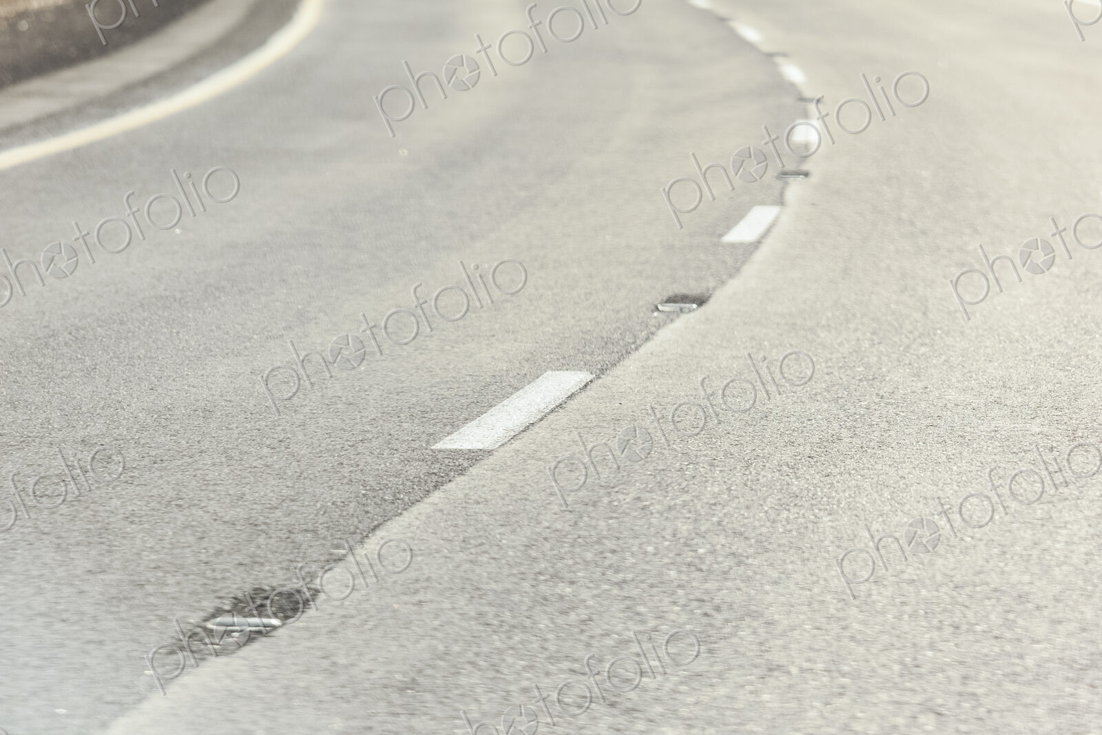 Close-up of the road surface on a curve in a road