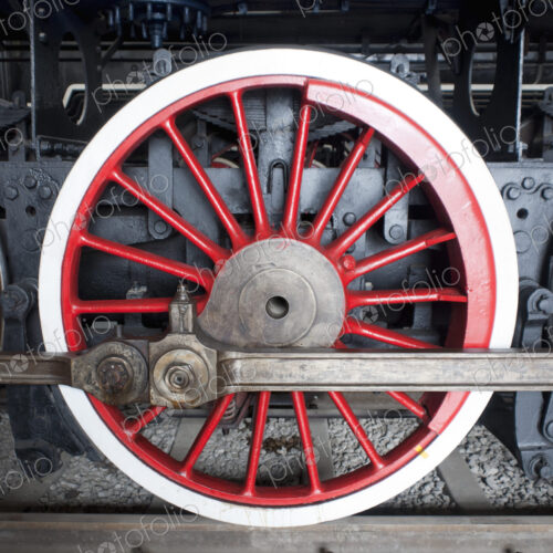 Close up of the rows of steel wheels of a locomotive steam train. Close up of the rows of steel wheels of a locomotive steam train.