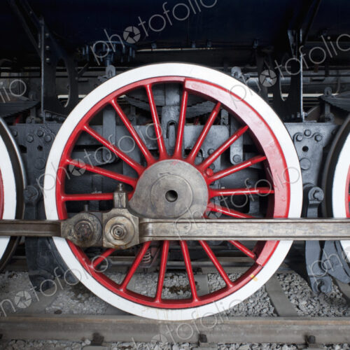 Close up of the rows of steel wheels of a locomotive steam train. Close up of the rows of steel wheels of a locomotive steam train.