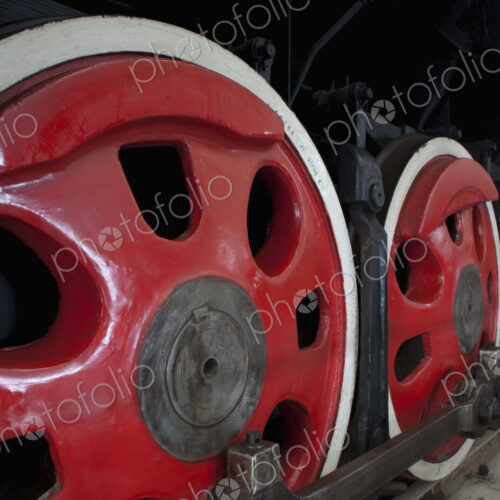 Close up of the rows of steel wheels of a locomotive steam train. Close up of the rows of steel wheels of a locomotive steam train.