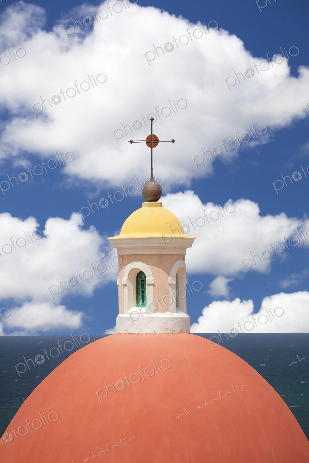 Close-up of the vibrant red dome and yellow cupola of the neoclassical rotunda at…