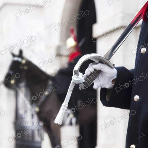 Close up of trooper at Horse Guards carrying sword on his shoulder, Whitehall, London,… Close up of trooper at Horse Guards carrying sword on his shoulder, Whitehall, London,…
