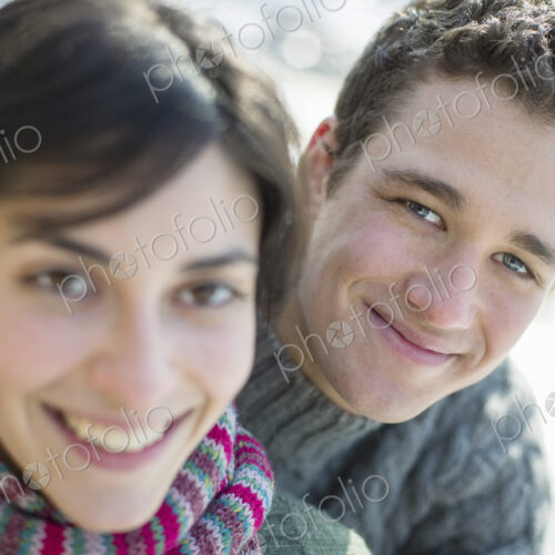 Close up of two people, man and woman, a couple outdoors on a winter day. Close up of two people, man and woman, a couple outdoors on a winter day.