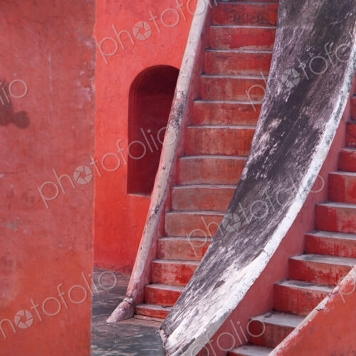 Close up of two steep stairway running parallel up a red building. Close up of two steep stairway running parallel up a red building.
