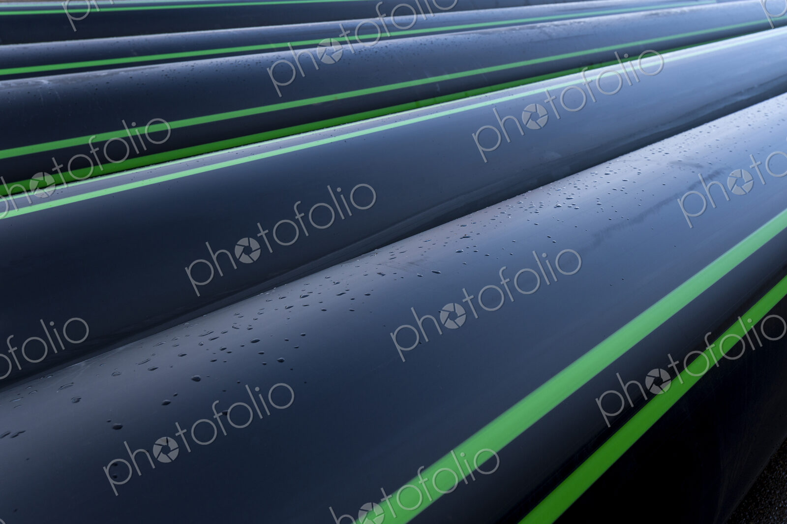 Close up of water pipes with water droplets.