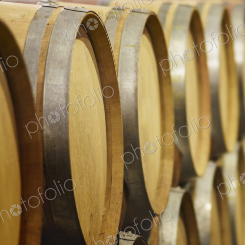 Close up of wine barrels in cellar Close up of wine barrels in cellar