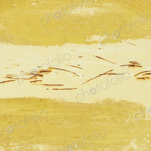 Close up of yellow paint and rusty scratch marks Close up of yellow paint and rusty scratch marks