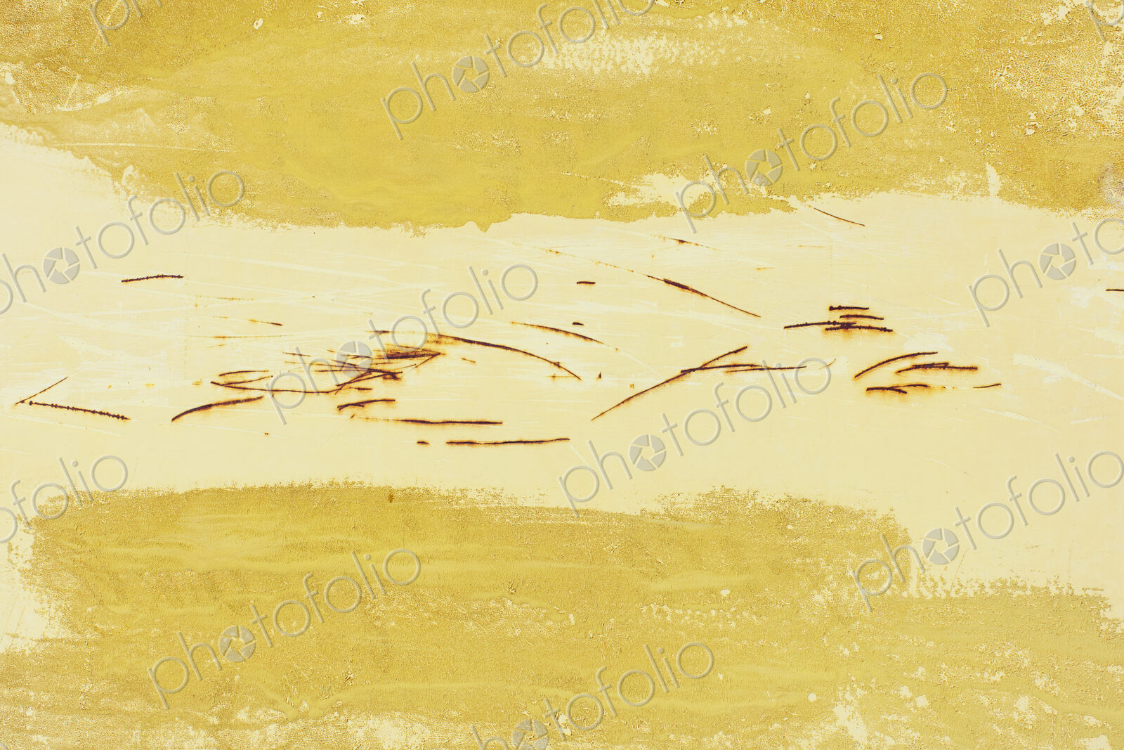 Close up of yellow paint and rusty scratch marks