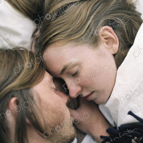 Close up of young couple sleeping. Close up of young couple sleeping.
