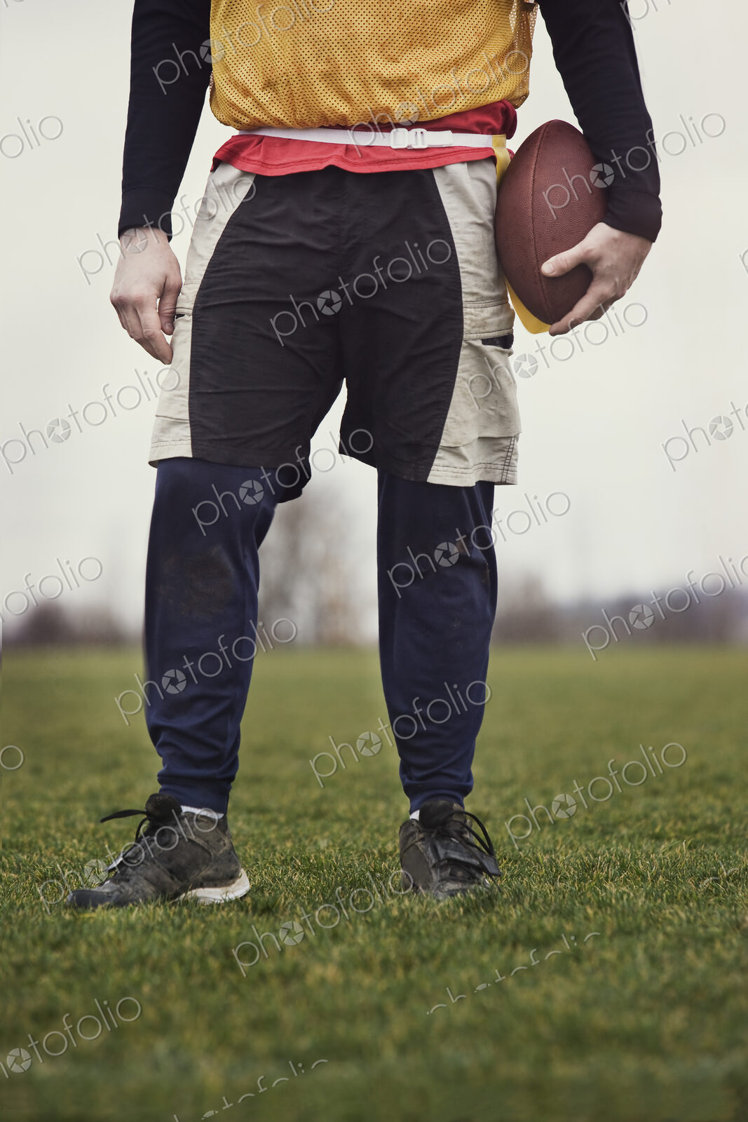 Close up view from the waist down of a male who is playing non-contact flag football.