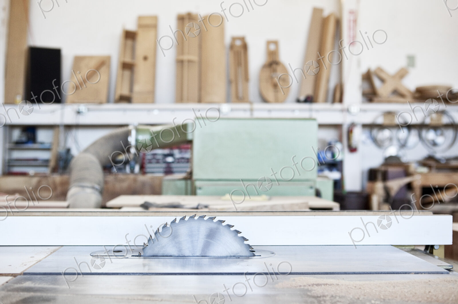 Close up view of a bank saw in a woodworking factory.