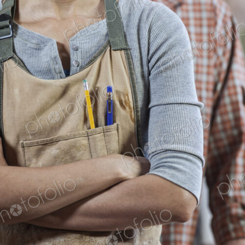 Close up view of workers in a woodworking factory. Close up view of workers in a woodworking factory.