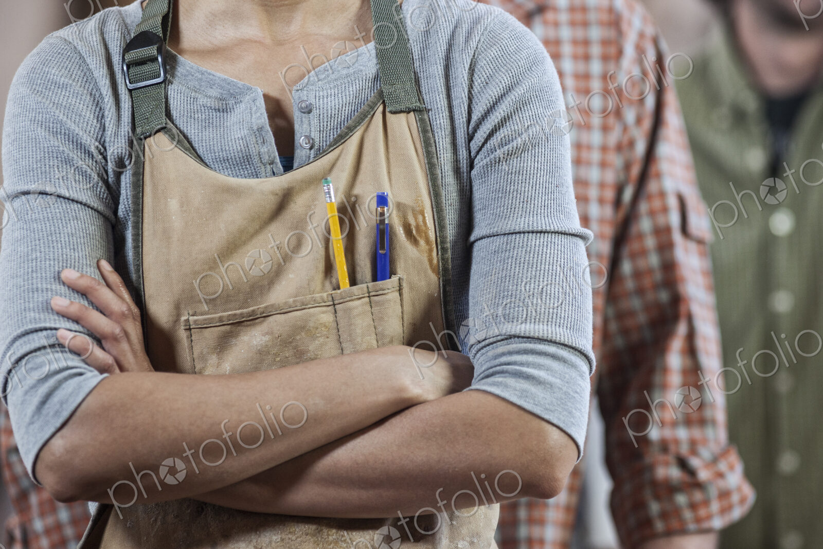 Close up view of workers in a woodworking factory.