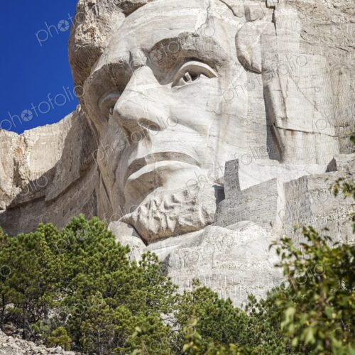 Close view of Abraham Lincoln carved in granite at Mount Rushmore National Memorial,… Close view of Abraham Lincoln carved in granite at Mount Rushmore National Memorial,…