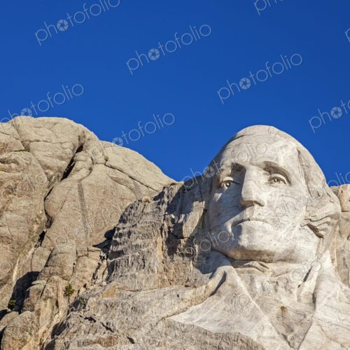 Close view of George Washington carved in granite at Mount Rushmore National Memorial… Close view of George Washington carved in granite at Mount Rushmore National Memorial…