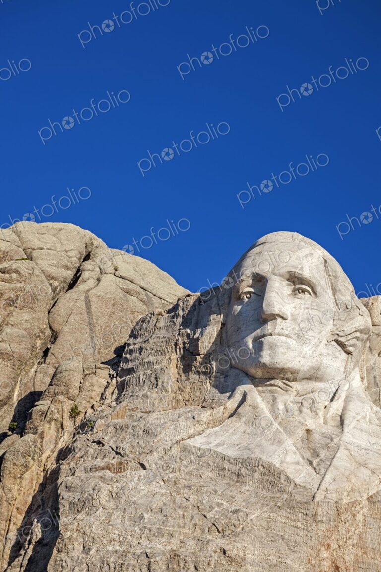 Close view of George Washington carved in granite at Mount Rushmore National Memorial…