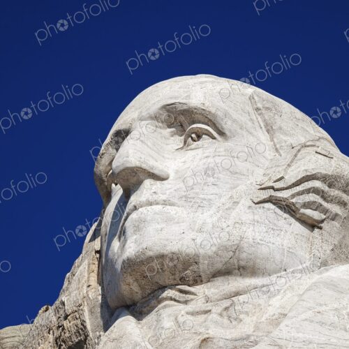 Close view of George Washington carved in granite at Mount Rushmore National Memorial… Close view of George Washington carved in granite at Mount Rushmore National Memorial…