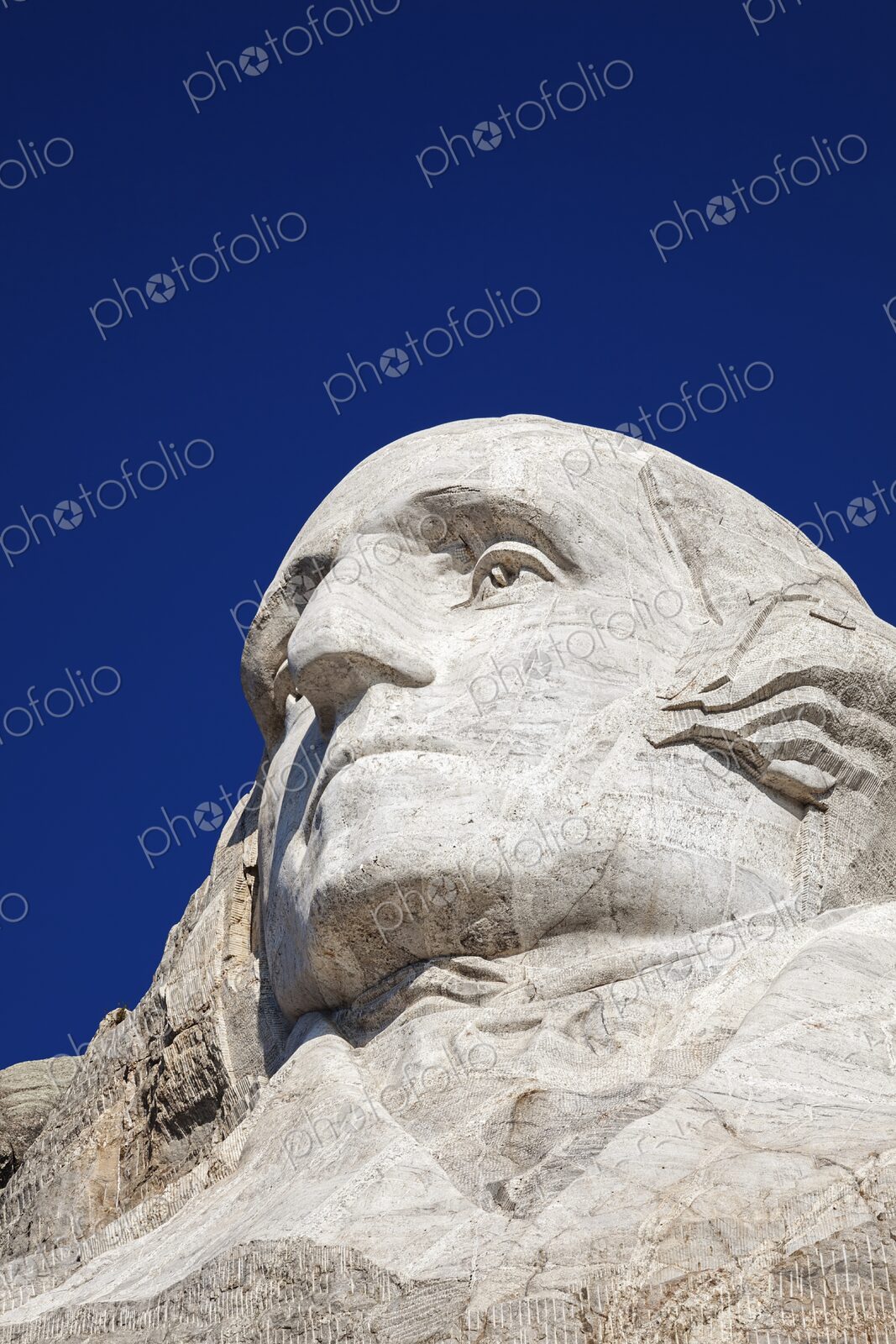 Close view of George Washington carved in granite at Mount Rushmore National Memorial…