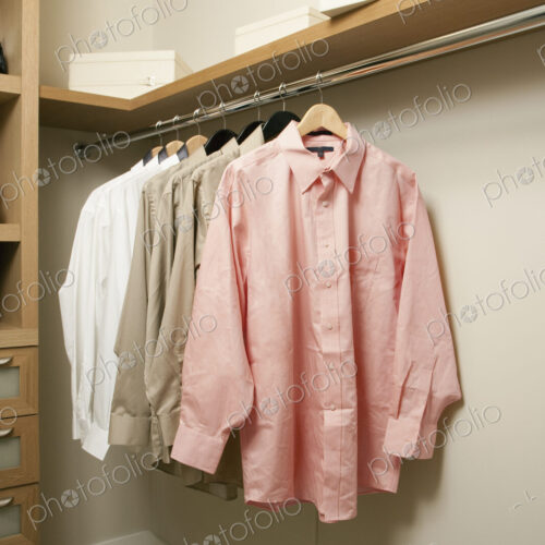 Closet with a rail of men's shirts