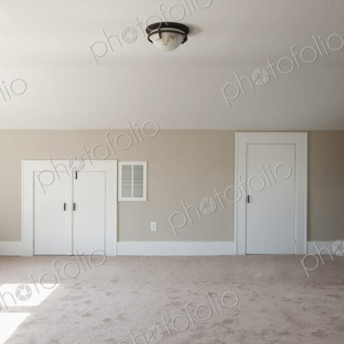 Closets in empty attic room Closets in empty attic room