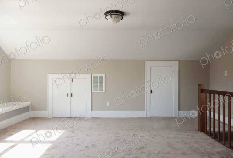 Closets in empty attic room