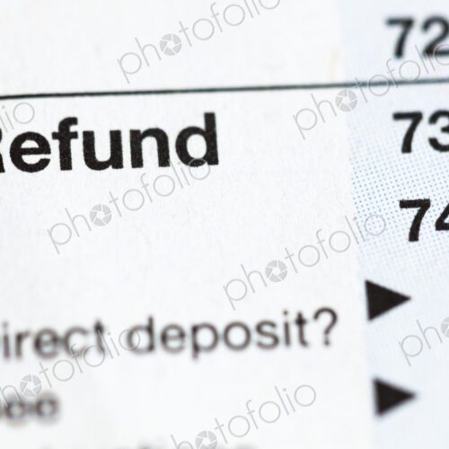 Closeup of United States personal tax form 1040, focus on the word “Refund”