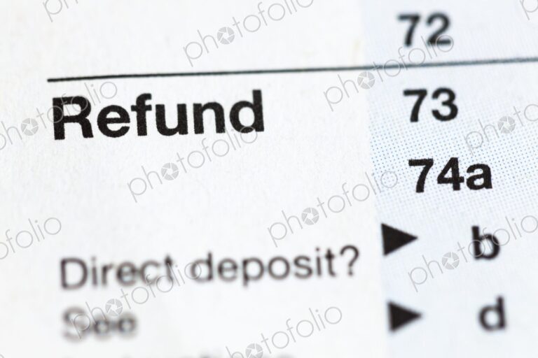 Closeup of United States personal tax form 1040, focus on the word “Refund”