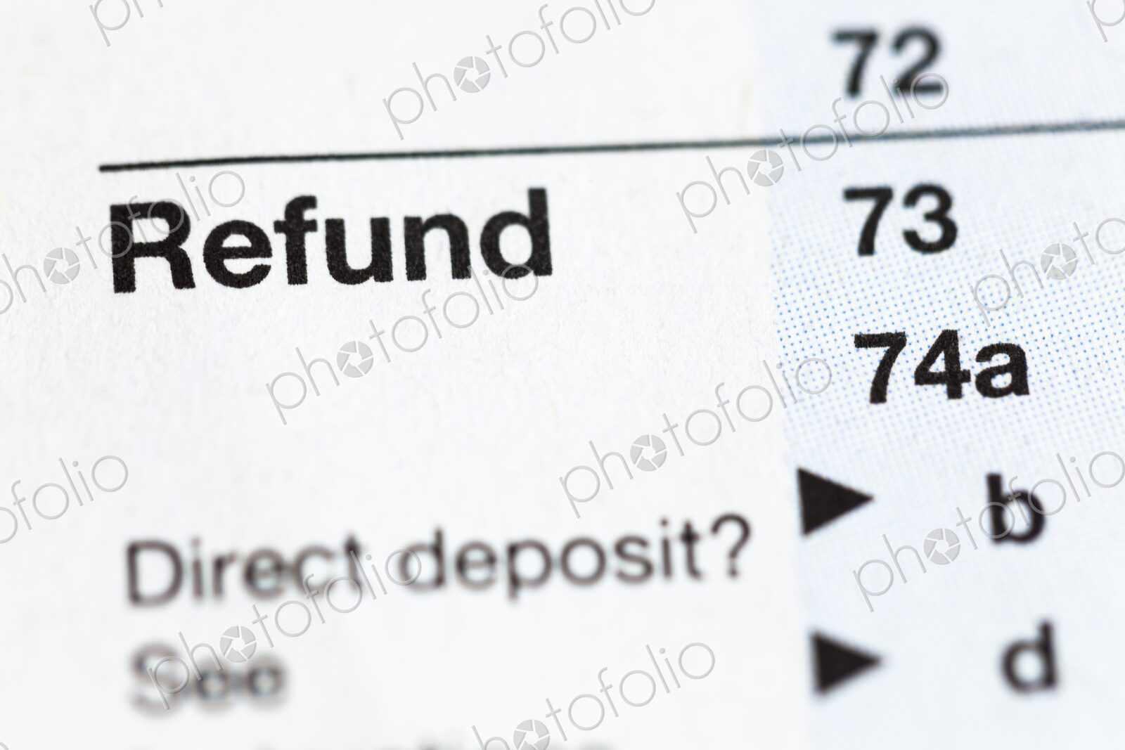 Closeup of United States personal tax form 1040, focus on the word “Refund”