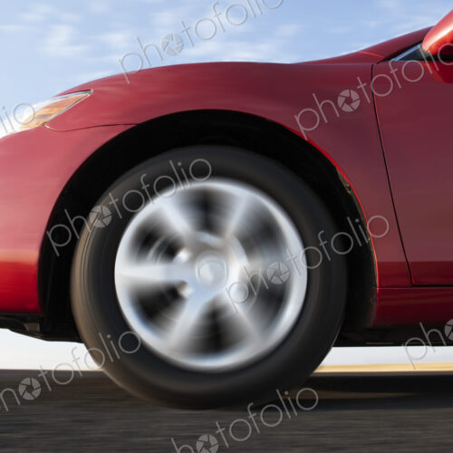 Closeup of a car tire on a highway. Closeup of a car tire on a highway.