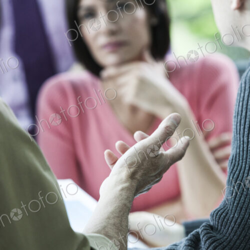 Closeup of a hand gesturing during a business meeting. Closeup of a hand gesturing during a business meeting.