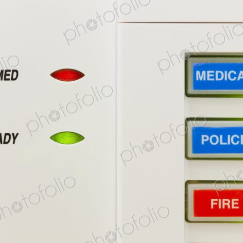 Closeup of alarm keypad showing the system is armed along with buttons for medical,…