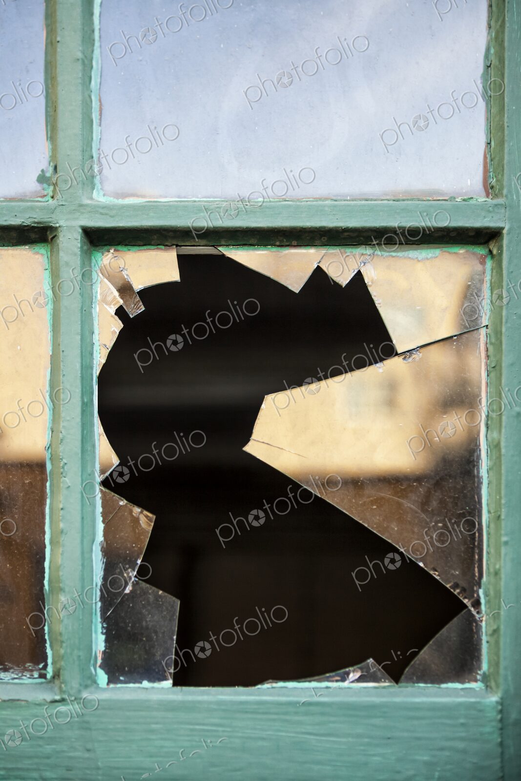 Closeup of broken glass in window pane